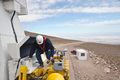 A worker inspects a transporter.