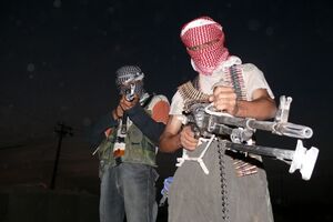 Two masked Iraqi men with weapons during the insurgency that followed the 2003 invasion of Iraq