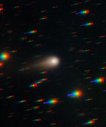 Color photo of 3I/ATLAS by Gemini South Observatory. The stars are colored streaks due to the tracking of the comet.[1]