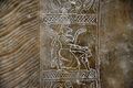 Detail of the embroidered dress of an Apkallu, showing a kneeling winged eagle-headed Apkallu. From Nimrud, Iraq. 883-859 BC. Ancient Orient Museum, Istanbul