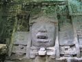 Detail of carving on right-hand (facing temple) wall of Mask Temple at Lamanai