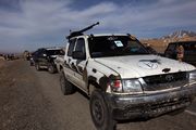 Hilux with DShK heavy machine gun mounted on it, operated by an Afghan private security company, 2010.