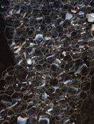 Foam of soap bubbles: four edges meet at each vertex, at angles close to 109.5°, as in two C-H bonds in methane.