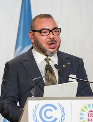 Mohammed standing behind a lectern