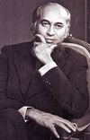 A black and white photo of Wajahat Haider, during a meeting